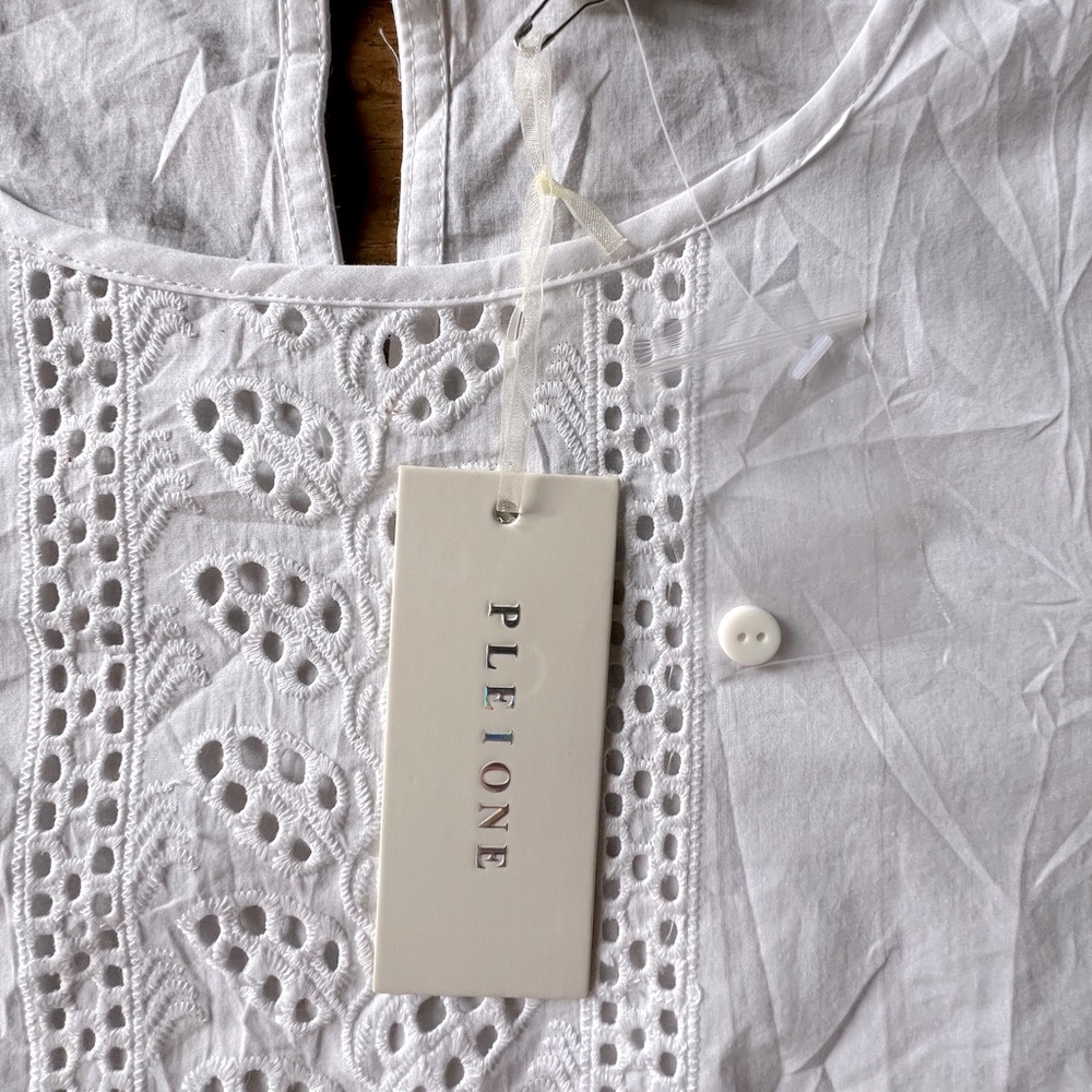 Pleione eyelet 100% cotton 3/4 ruffle sleeve top.